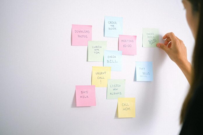 Sticky Notes with To-do List on the White Wall